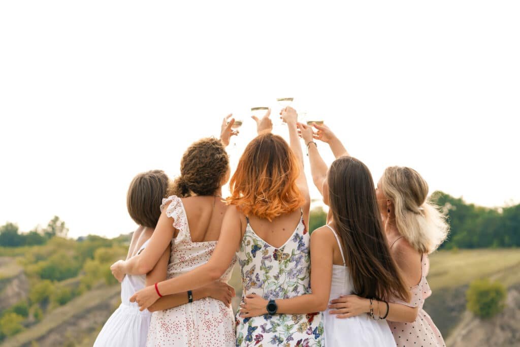 Group toasting during a bachelorette party in Provence