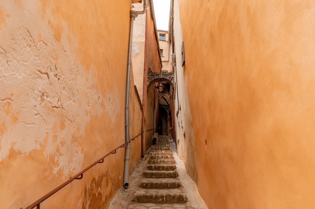 Sunlit village square in Provence capturing authentic life beyond Instagram clichés