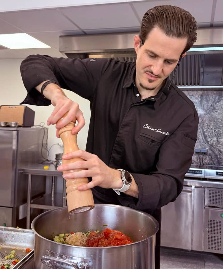 Chef Clément preparing a Provençal dish during a private cooking class