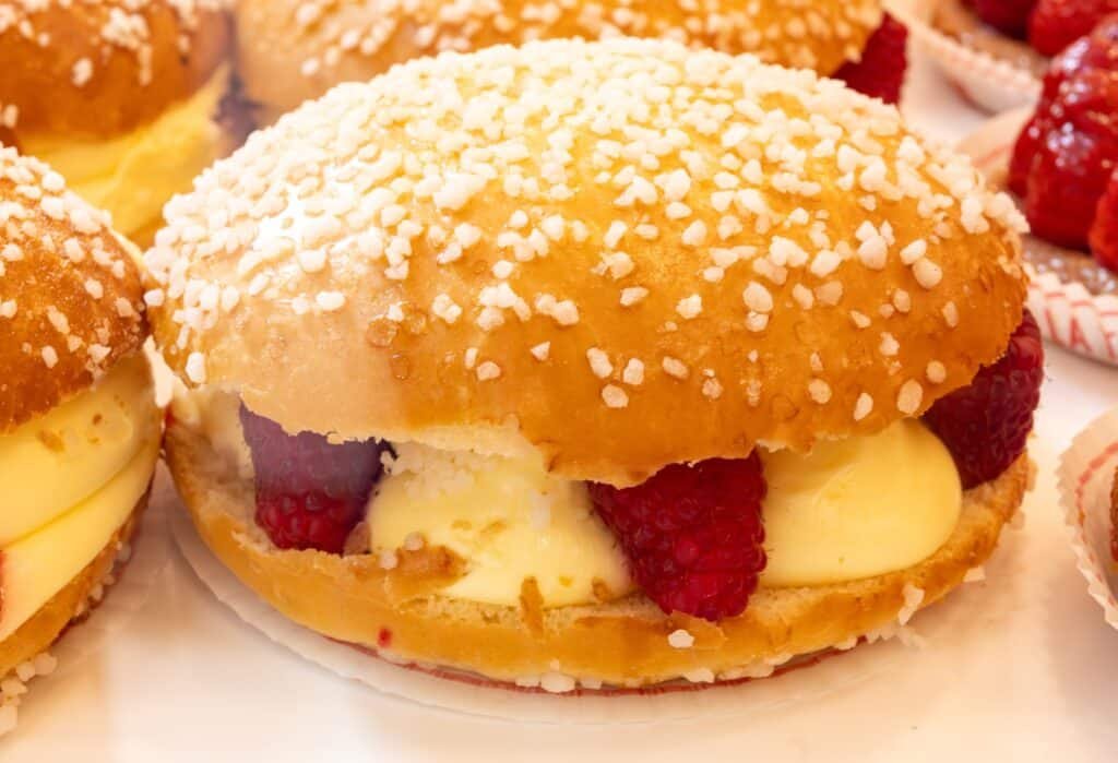 Traditional Tarte Tropézienne from Provence with brioche, orange blossom cream and pearl sugar served in Saint-Tropez