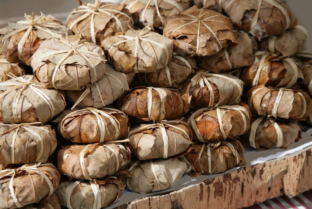Authentic Banon cheese wrapped in chestnut leaves on a Provençal market stall